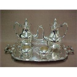 Four piece silverplated tea and coffee service on silverplated tray, teapot and coffee pot with h...