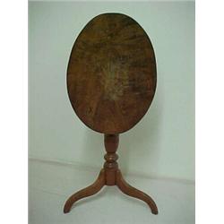 Walnut tilt top table, oval top on turned standard, three spider legs, early 19th C. Estimate...