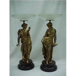 A pair of figural tazzas, each with frosted crystal bowls over gilt metal standing Grecian female...