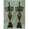 Image 1 : A pair of spelter candelabrum, each with six candleholders on urns, standing on rectangular slate...