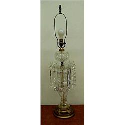 Cut glass lamp with cut crystal prisms on gilt metal round base, measures 23 1/2" high to top of...