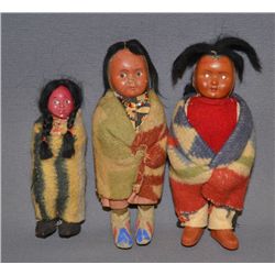 THREE SKOOKUM DOLLS