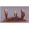 Image 1 : Shawn Thomas stone carving of three heads.  Iroquois