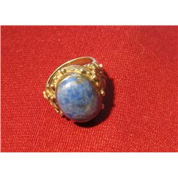 806. Sterling silver ring with large blue stone with silver streaks, marked ©96 925