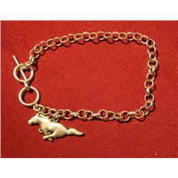819. Silver link bracelet with a (Ford) Mustang running pony charm. Bracelet and charm both marked 9