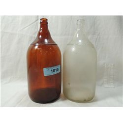 LOT 2 VINTAGE HALF GALLON GLASS BOTTLES