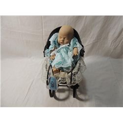 SMALL BABY DOLL IN WOODEN AND WICKER CARRIAGE