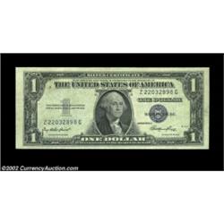 Fr. 1614 $1 1935E Silver Certificate. About Uncirculated.A dark front-to back offset is present on t