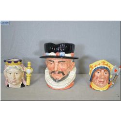 One large and two small Royal Doulton character jugs including Beefeater D6206, Queen Victoria D6913