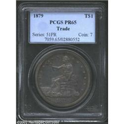 1879 T$1 PR65 PCGS. This Gem quality survivor is deeply toned in charcoal-gray shades with blushes o