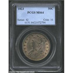 1823 50C MS64 PCGS. O-103, R.2. The surfaces show strong luster characteristics beneath the deep iri