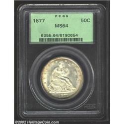 1877 50C MS64 PCGS. An appealing, heavily frosted coin with tinges of golden peripheral color. The s