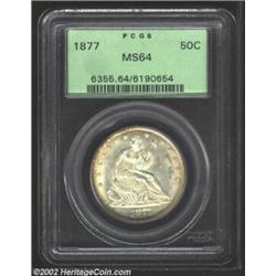 1877 50C MS64 PCGS. An appealing, heavily frosted coin with tinges of golden peripheral color. The s