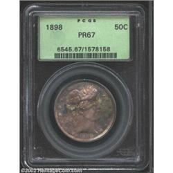 1898 50C PR67 PCGS. Mottled lavender-gray patina dominates this coin's outward appearance, but there