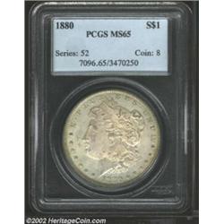 1880 S$1 MS65 PCGS. The obverse side of this respectable Gem is covered by rich pastel patina, which