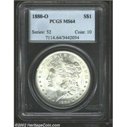 1880-O S$1 MS64 PCGS. A very nice near-Gem, with very good eye appeal. The obverse surfaces are bril