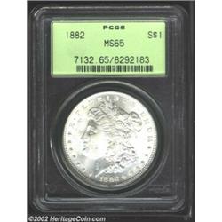 1882 S$1 MS65 PCGS. Fully struck throughout with frosted surfaces. Remarkably clean with the only me