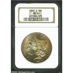 1882-S S$1 MS64 NGC. A sharply struck near-Gem that is dominated by gorgeous orange-gold patina. The