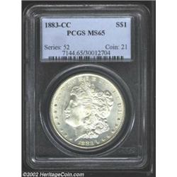 1883-CC S$1 MS65 PCGS. Brilliant with creamy-white surfaces and smooth, nearly unblemished surfaces.