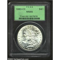 1883-CC S$1 MS65 PCGS. A brilliant, lustrous Gem with dazzling snow-white surfaces. A wispy die crac