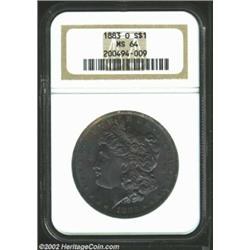 1883-O S$1 MS64 NGC. Dense mauve and green patina on the obverse, with a band of gold color on the r