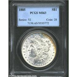 1885 S$1 MS63 PCGS. Well struck and flashy but with a few luster grazes. The reverse has gold, viole