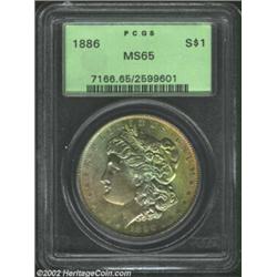 1886 S$1 MS65 PCGS. The obverse has yellow-green, gold, and champagne-rose patina. Boldly struck and