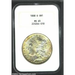 1888-O S$1 MS65 NGC. Smooth and lustrous, with golden accents in various areas on the obverse. On th