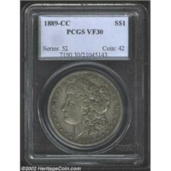 1889-CC S$1 VF30 PCGS. Dove-gray color, Miss Liberty's ear and most of her hairlines are clearly def