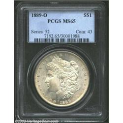 1889-O S$1 MS65 PCGS. Lightly and evenly toned, the surfaces are remarkably lustrous and vibrant for