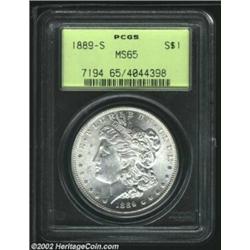 1889-S S$1 MS65 PCGS. A sharply struck and flashy Gem that has faint freckles of green-gray color on