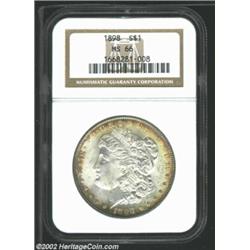 1898 S$1 MS66 NGC. The borders have pleasing golden-brown and electric-blue patina. Sharply struck i