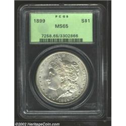 1899 S$1 MS65 PCGS. Boldly struck with very clean, satiny surfaces, this conditionally scarce Gem is