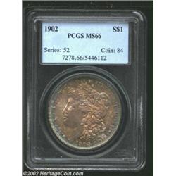 1902 S$1 MS66 PCGS. The borders have iridescent aqua, apple-green, violet, and copper-gold patina. W