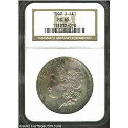 1902-O S$1 MS65 NGC. Both sides are blanketed in hazy pastel shades with a burst of orange-red color