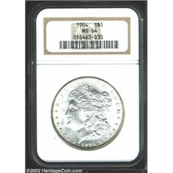 1904 S$1 MS64 NGC. Well detailed with untoned surfaces that display cartwheel luster over both field