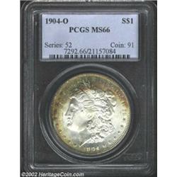 1904-O S$1 MS66 PCGS. Rich copper-olive, russet, and cobalt blue toning exists in crescents around m