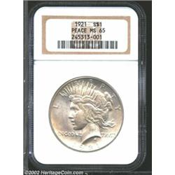 1921 S$1 MS65 NGC. Light tan toning accents the clean, abrasion free surfaces of this Gem. The strik