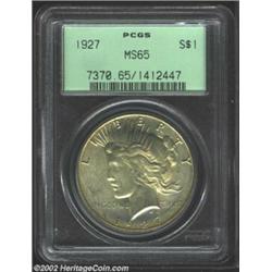 1927 S$1 MS65 PCGS. Dusky apricot and powder-blue color. A well struck Gem that has excellent luster