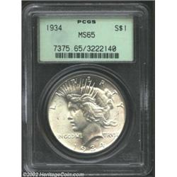 1934 S$1 MS65 PCGS. A pleasing Gem with bold luster, an exceptional strike, and distraction free sur