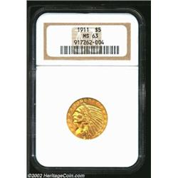 1911 $5 MS63 NGC. A sharply struck piece with bright yellow-gold color and mildly reflective fields.