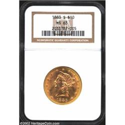 1883-S $10 MS63 NGC. The otherwise orange-gold coloration lightens to golden-rose shades in the cent