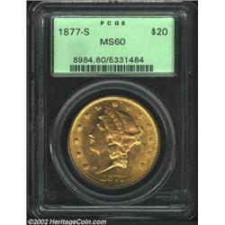 1877-S $20 MS60 PCGS. A lustrous and richly toned specimen that has no more than the expected number