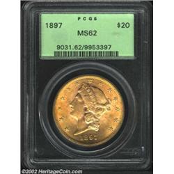 1897 $20 MS62 PCGS. The fields have blushes of honey-gold patina. A lustrous and crisply struck Doub