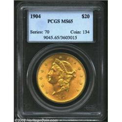 1904 $20 MS65 PCGS. Fully struck with glowing mint frost over each side and subtly patinated with an