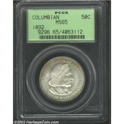 1892 50C Columbian MS65 PCGS. Deliciously frosty, with icy white surfaces accented with golden tone.