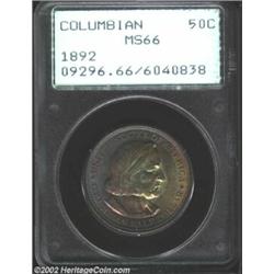 1892 50C Columbian MS66 PCGS. Both sides of this shimmering Gem are blanketed in varied shades of or