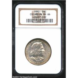 1892 50C Columbian MS66 NGC. Bright and satiny with a hint of peripheral color. A superlative, nearl