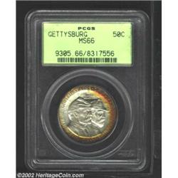 1936 50C Gettysburg MS66 PCGS. A crescent of fiery-red and sunset-golden color is seen at part of th