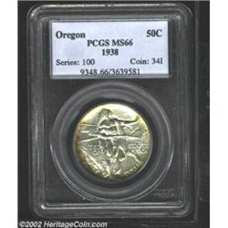 1938 50C Oregon MS66 PCGS. Subtle multicolored hues are seen amid the even gray patina. Important no